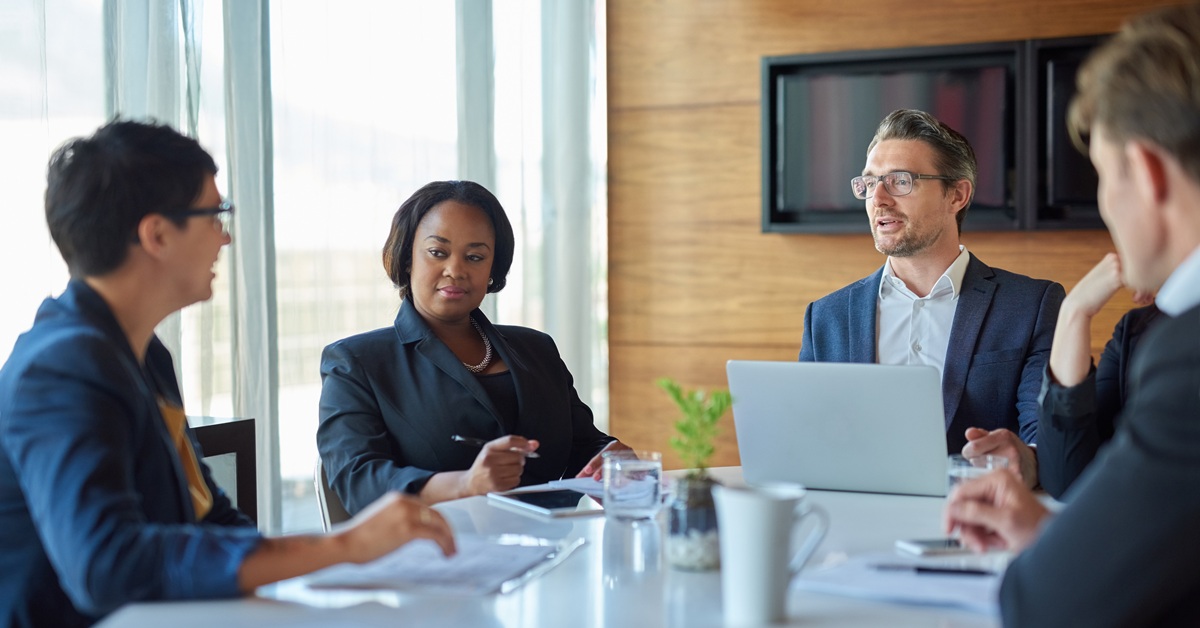 business professionals discussing over a meeting