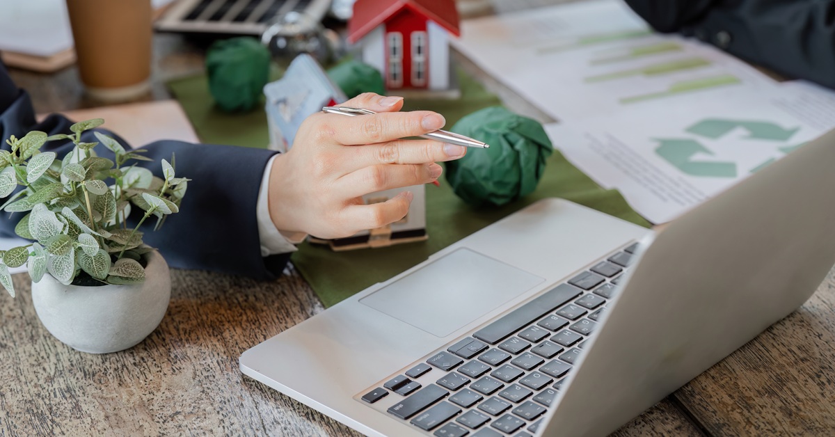 laptop next to data and home models