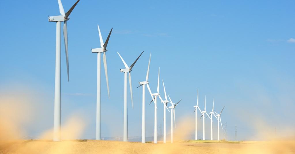 wind turbines in sandy field