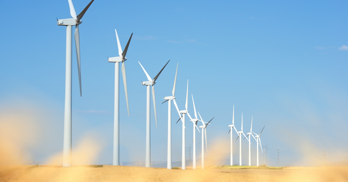 wind turbines in sandy field
