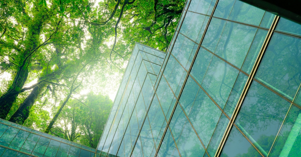 glass building underneath trees with in sunlight