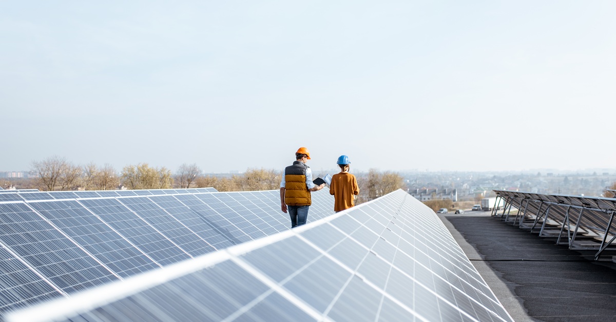 view of engineers inspecting solar panels
