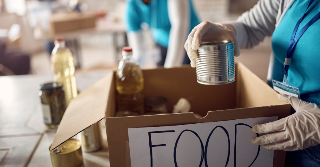 volunteers packing food donations into boxes